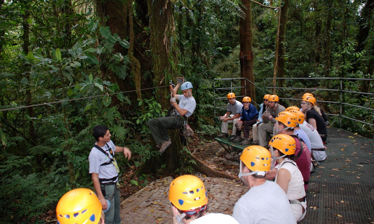 Instructors train a group of zip liners